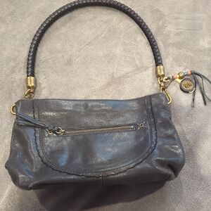 The Sak Black Leather Shoulder Bag with Gold Accents